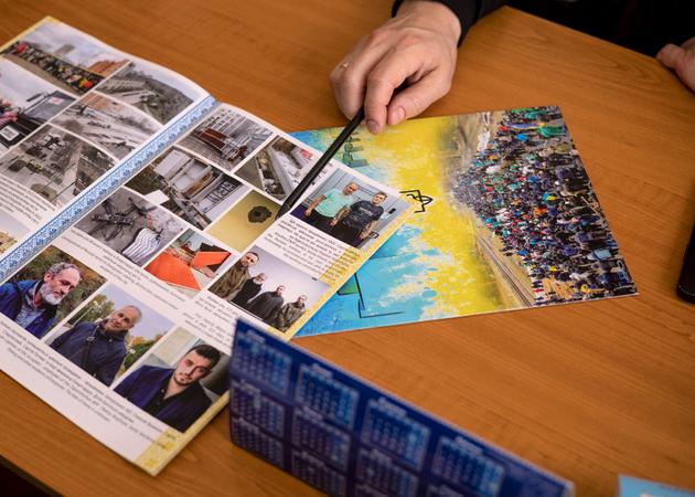 Dmytro Orlov, mayor of Enerhodar in exile, shows residents and workers of the nuclear power plant detained by Russian forces, in Zaporizhzhia, southeastern Ukraine, March 12, 2025.