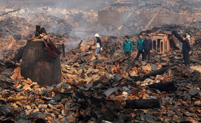A bell is seen broken at the remains of the bell pavilion due to wildfires at Gounsa Temple in Uiseong, South Korea, Wednesday, March 26, 2025.