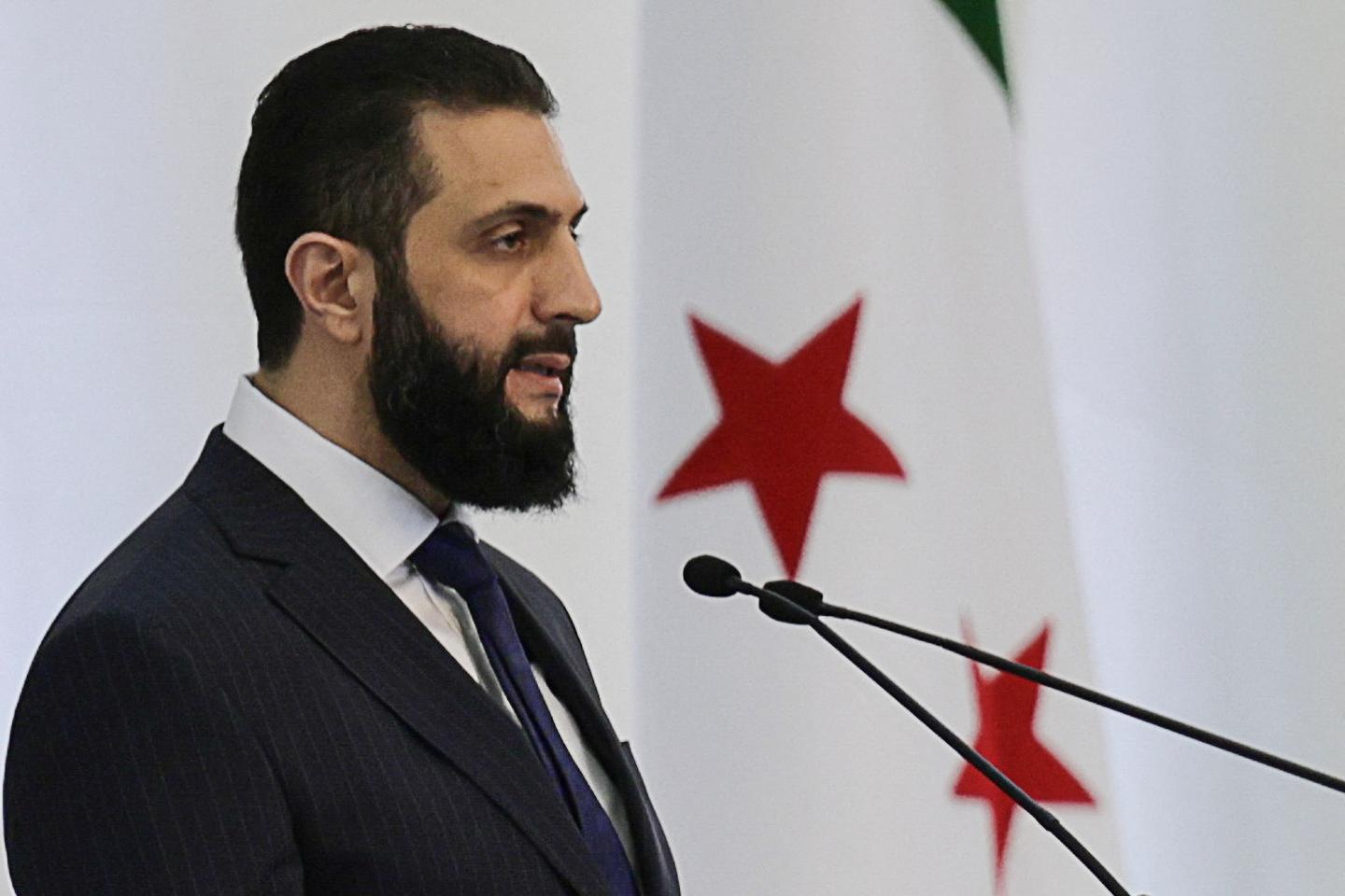 Syria's interim president names new government dominated by allies