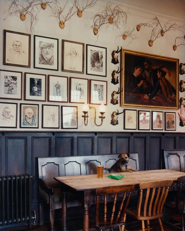 On the pub wall, portraits by Gideon Summerfield depicting personalities from the village of Braemar, and a reproduction of a Caravaggio painting, "The Cardsharps."