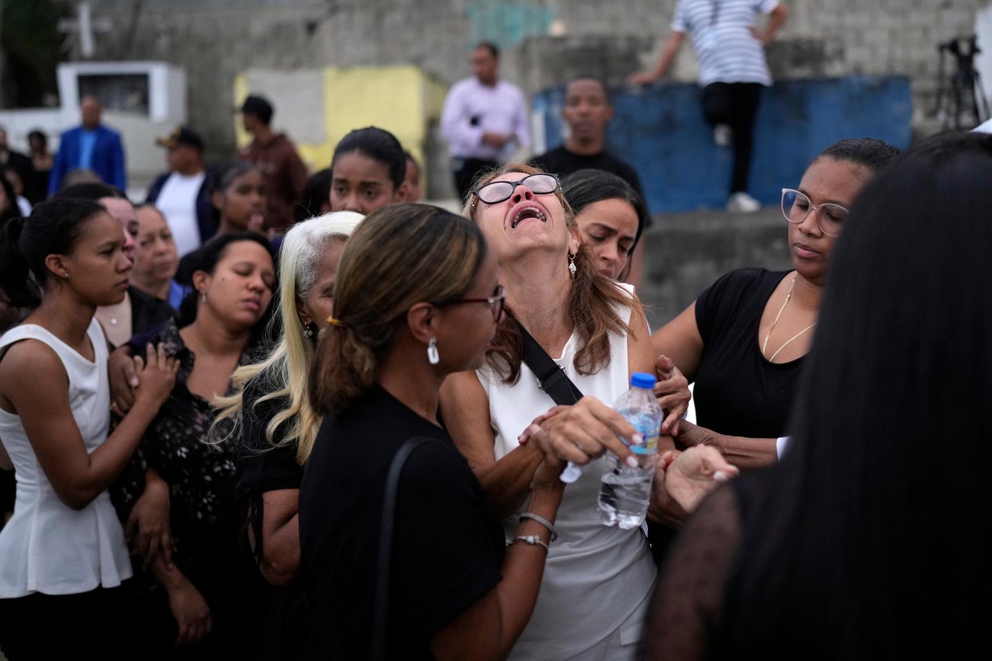 Dominicans begin to hold funerals for victims of the tragic nightclub roof collapse: 'No one will be left unidentified'