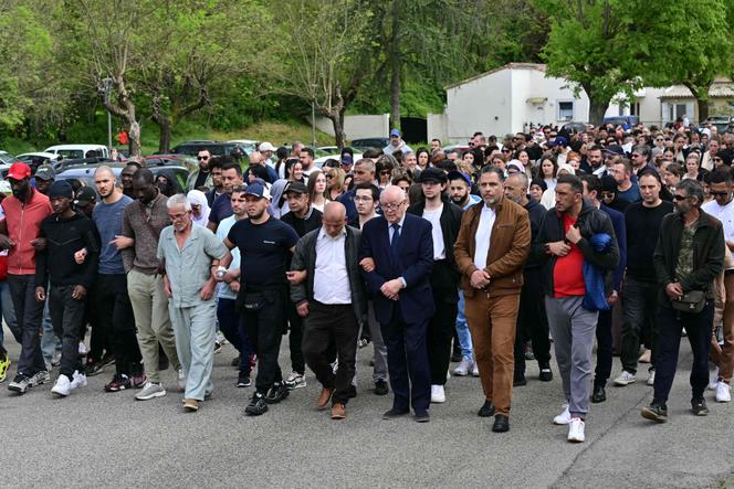 People march in La Grand-Combe, southern France, on April 27, 2025, to pay tribute to a worshiper killed by several dozens of stab wounds inside the mosque Khadija in La Grand-Combe on April 25.