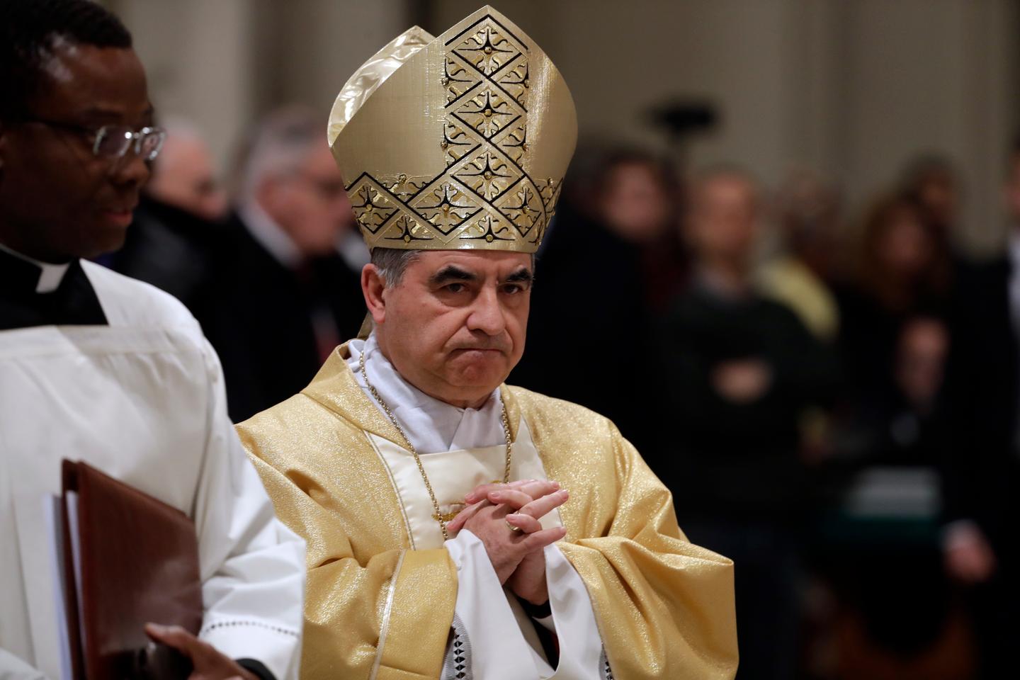 Italian cardinal convicted of embezzlement confirms he will sit out conclave