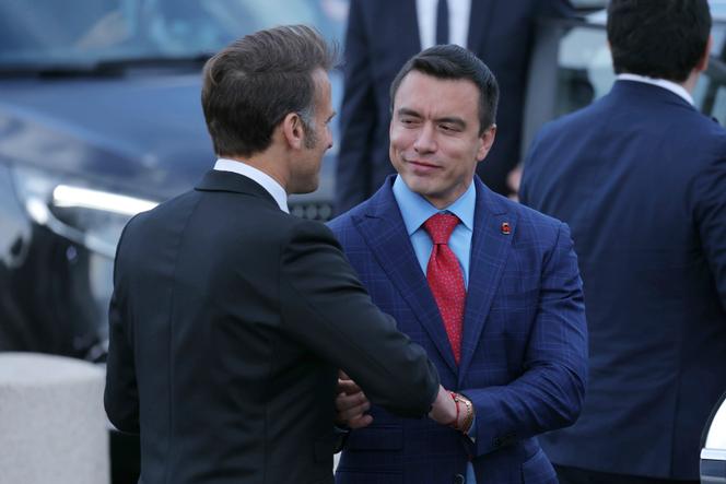 French President Emmanuel Macron shakes hands with Ecuador's President Daniel Noboa during ceremonies marking the 80th anniversary of the end of World War II in Europe on May 8, 2025, in Paris.