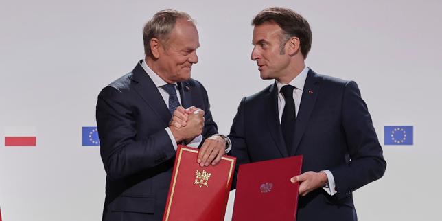 France and Poland sign reciprocal defense treaty that 'learns from history'
