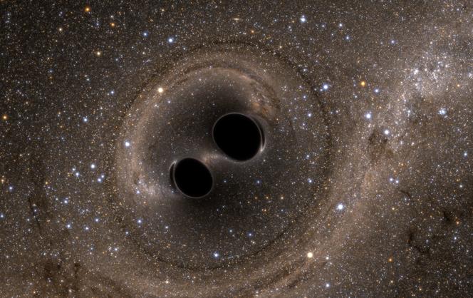 Vue d’artiste de la collision de deux trous noirs – un événement détecté pour la première fois par l’Observatoire d’ondes gravitationnelles de l’interféromètre laser, ou LIGO.