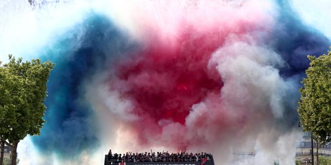 PSG holds victory parade in Paris with Champions League trophy after overnight violence