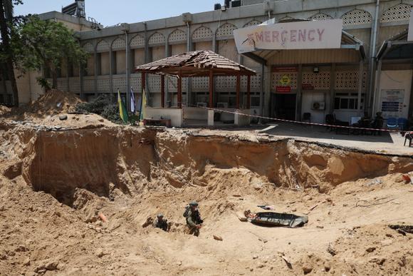 Israeli soldiers emerge from a tunnel under Khan Younis Hospital during a ground operation in the Gaza Strip on Sunday, June 8, 2025.
