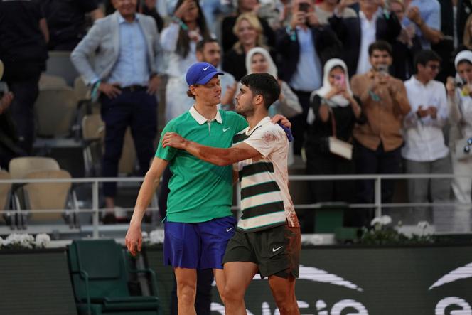 Spanish winner Carlos Alcaraz, right, and Italy's Jannik Sinner after the final of the Roland-Garros tennis tournament in Paris, Sunday, June 8, 2025.