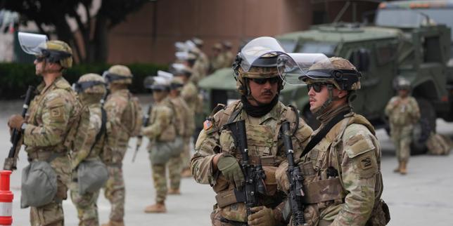 National Guard troops deployed by Trump arrive in Los Angeles amid protests over immigration raids