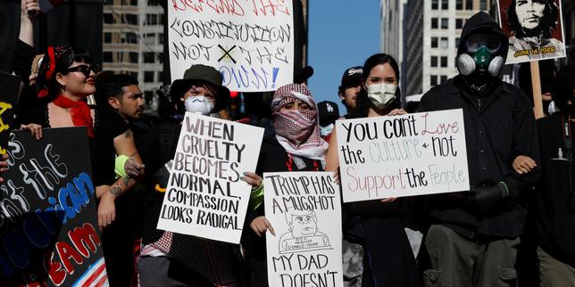Anti-Trump protesters rally across US on same day as military parade
