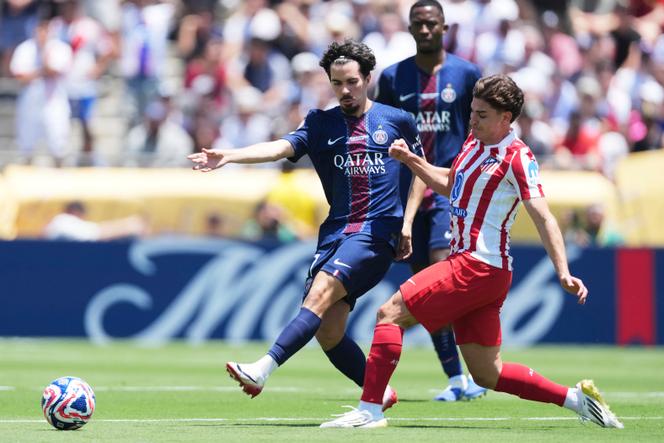 Paris Saint-Germain's Vitinha, left, and Atletico Madrid's Julian Alvarez battle for the ball during the Club World Cup group B soccer match between PSG and Atletico Madrid in Pasadena, California, on Sunday, June 15, 2025.