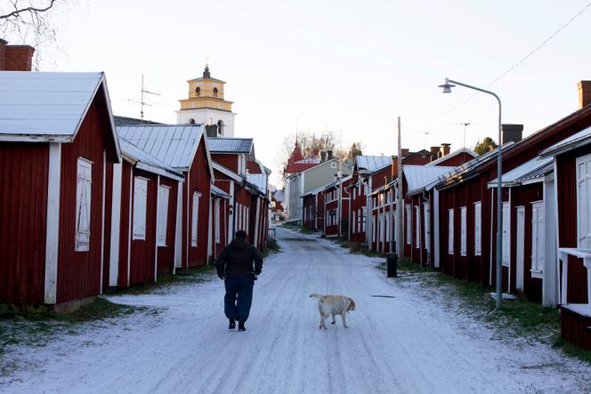 A man walks through the streets of the old town in Lulea, Sweden, in November 2012.