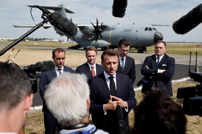 French President Emmanuel Macron, surrounded by French Minister of Armed Forces Sébastien Lecornu, Minister for Industry and Energy Marc Ferracci, Minister in charge of Higher Education and Research Philippe Baptiste and Minister for Transport Philippe Tabarot, talks to journalists after disembarking from an Airbus A400M military plane for a visit at the 55th International Paris Airshow at Le Bourget Airport near Paris, France, June 20, 2025. 