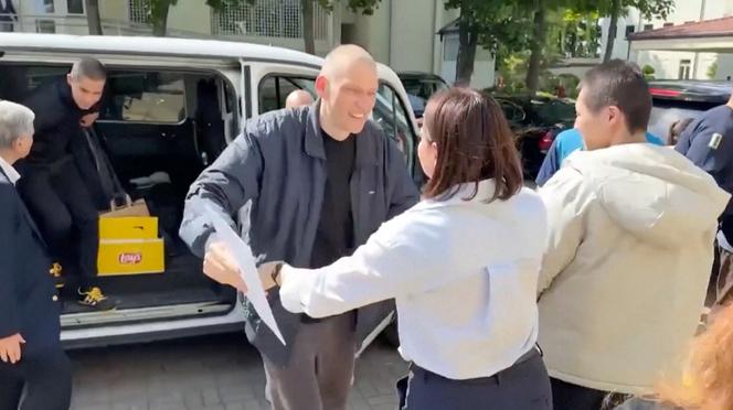 Belarus opposition leader Siarhei Tsikhanouski greets his wife Sviatlana Tsikhanouskaya after being released from prison, in this screengrab taken from a social media video released on June 21, 2025.