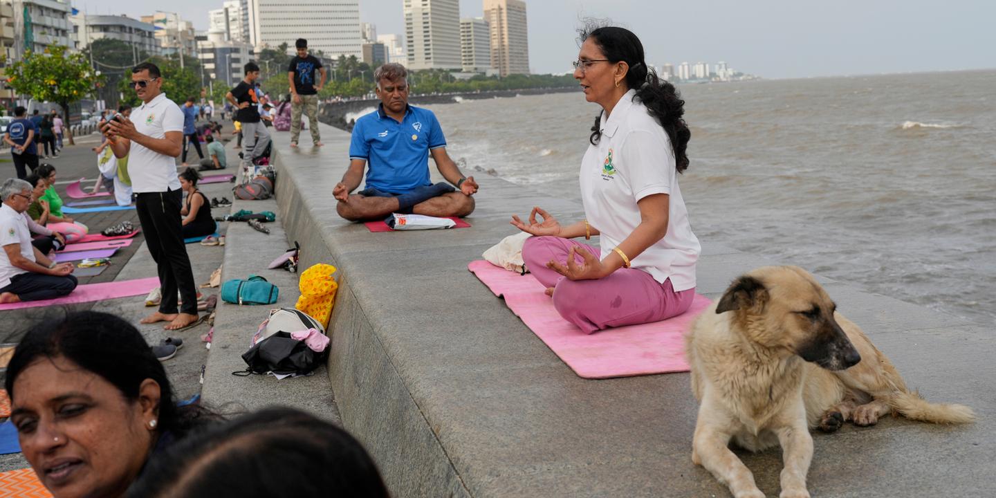 In India, thousands stretch to celebrate International Yoga Day