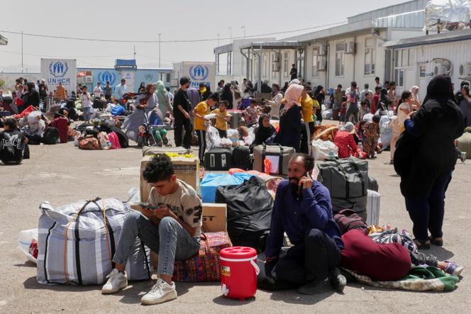 Des réfugiés afghans rentrés au pays après avoir fui l’Iran pour échapper à l’expulsion et au conflit, près du point de passage d’Islam Qala dans la province occidentale de Herat, en Afghanistan, le vendredi 20 juin 2025.