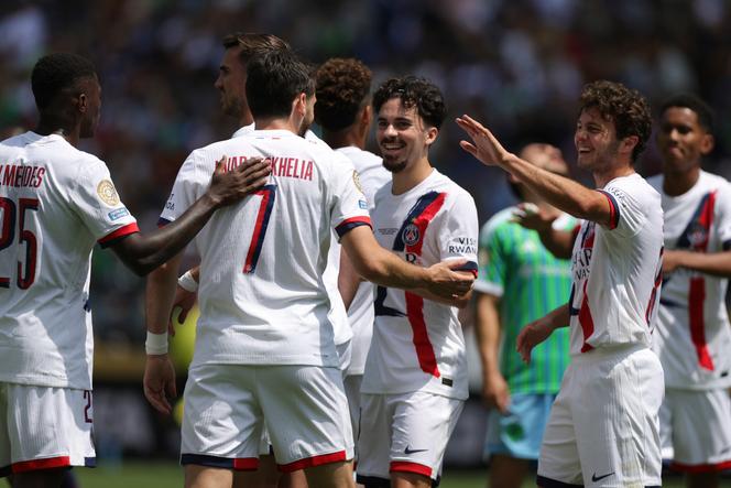 Paris Saint-Germain's Khvicha Kvaratskhelia, second left, celebrates after scoring his side's first goal during the Club World Cup Group B soccer match between Seattle Sounders and PSG in Seattle, Monday, June 23, 2025.