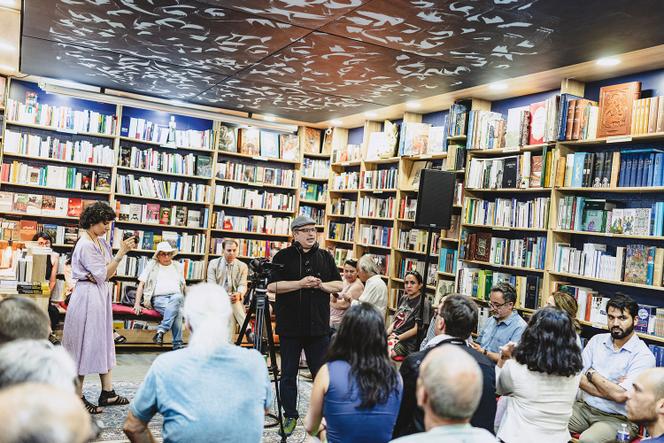 Tinouche Nazmjou during a debate at his Utopiran bookshop in Paris, June 20, 2025.
