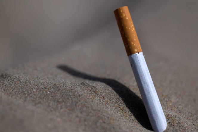 This photograph shows a cigarette on a beach in Saint-Nic, western France, on June 24, 2025.