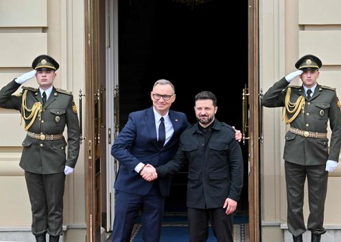 The outgoing Polish president, Andrzej Duda, and the Ukrainian president, Volodymyr Zelensky, shake hands upon arrival for their meeting in front of the presidential palace in kyiv, June 28, 2025. volodymyr zelensky judges "extremely important"