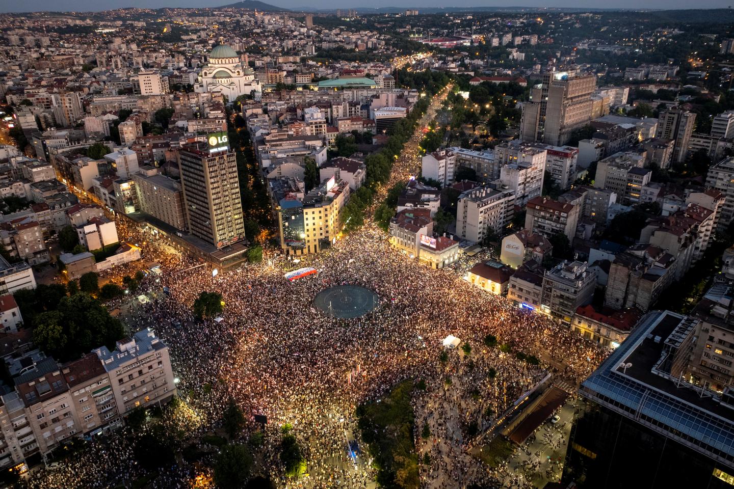 Serbian riot police fire tear gas at anti-government protesters demanding an early election