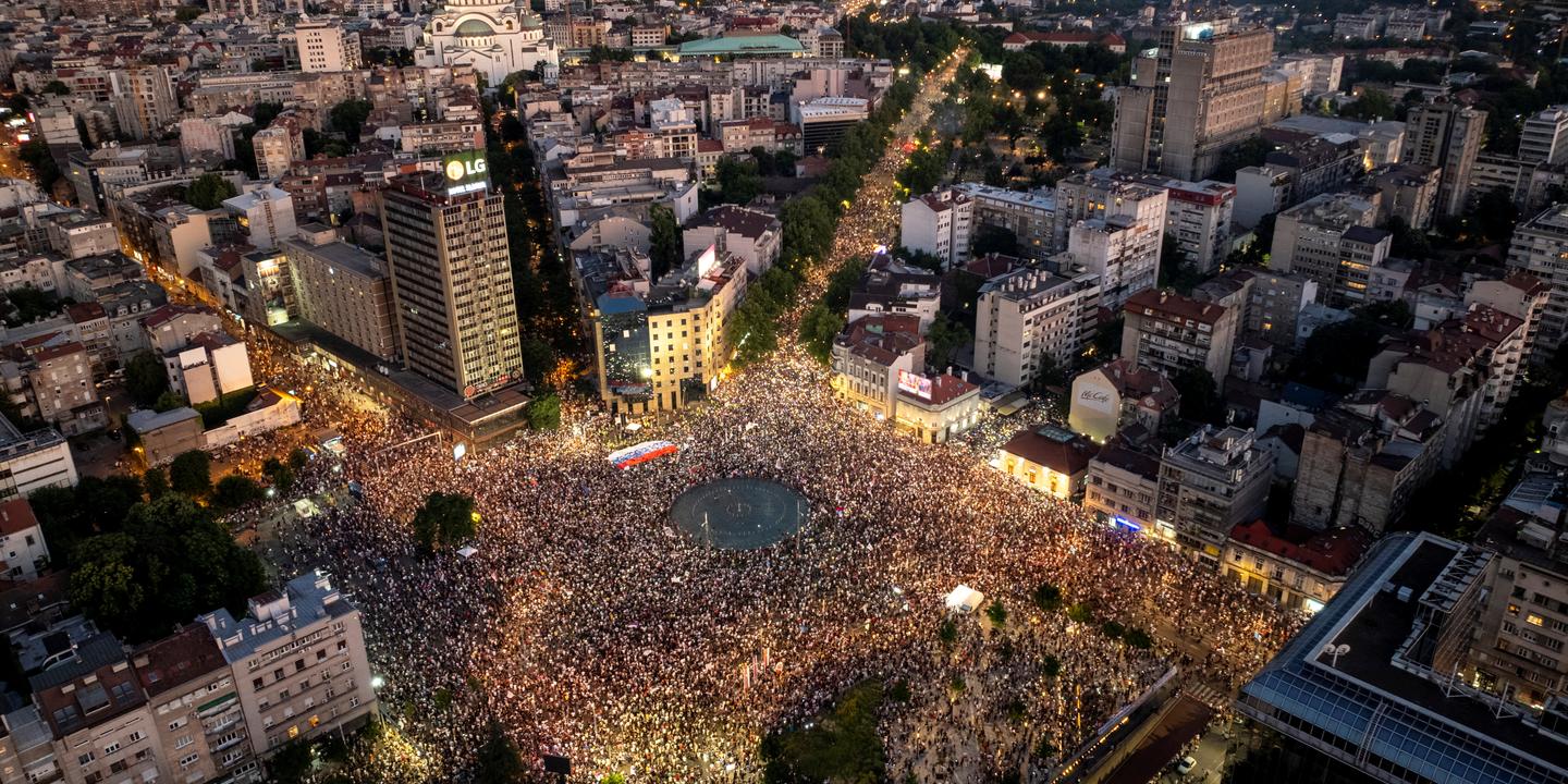Serbian riot police fire tear gas at anti-government protesters demanding an early election