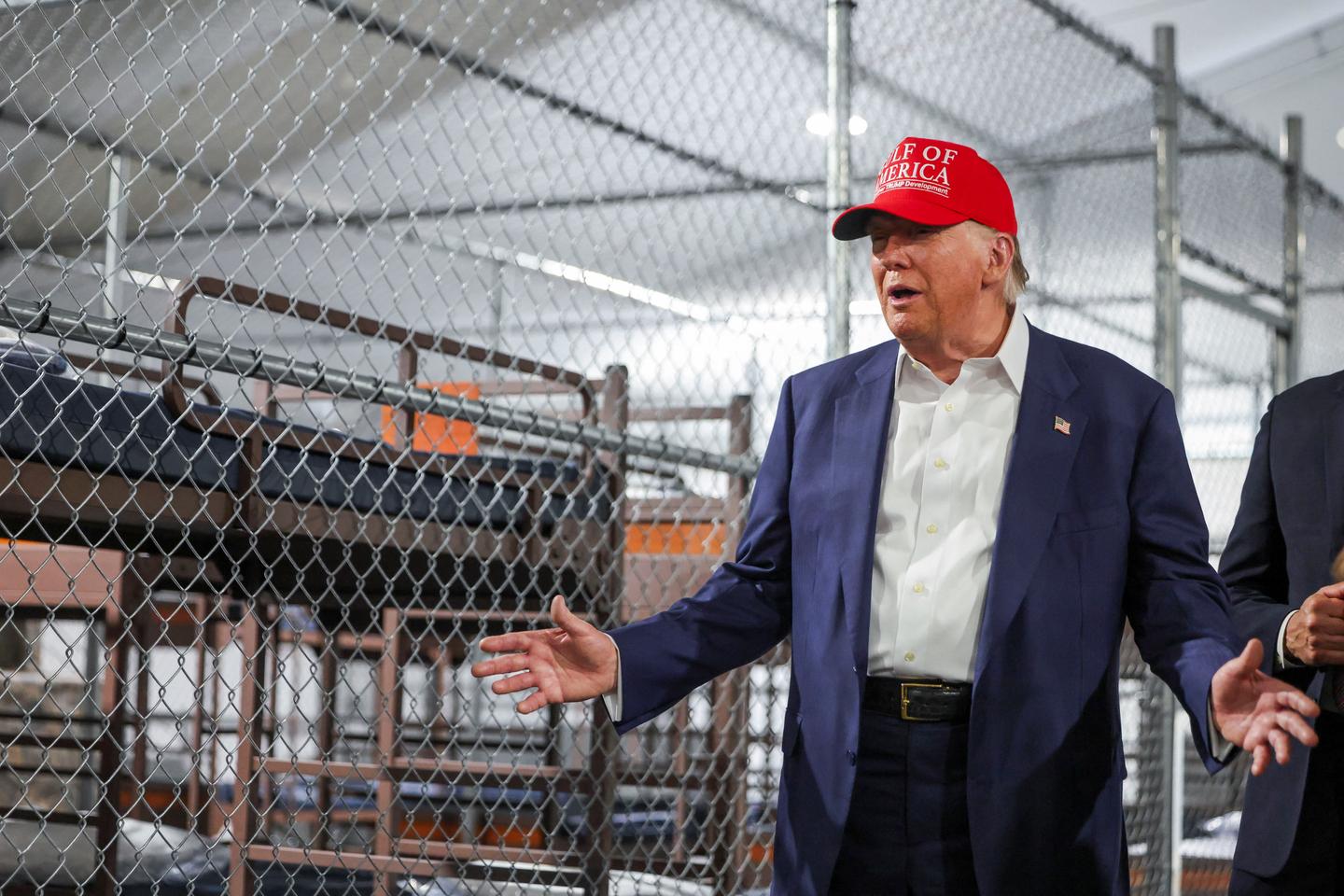 Trump tours Florida immigration lockup and jokes about escapees having to run from alligators