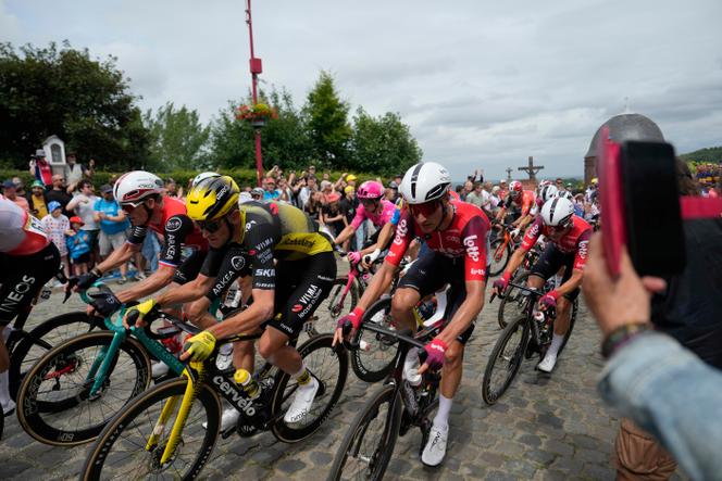 The pack rides during the first stage of the Tour de France cycling race over 184.9 kilometers (114.9 miles) with start and finish in Lille, France, Saturday, July 5, 2025.