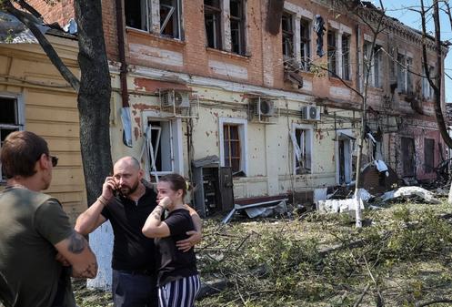 Residents at the site of a Russian drone attack in Kharkiv, Ukraine, July 7, 2025.