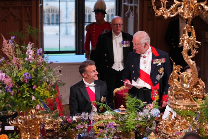 Britain's King Charles III speaks at the State Banquet for President of France Emmanuel Macron, left, and his wife Brigitte Macron, at Windsor Castle, in Windsor, England, Tuesday, July 8, 2025. (Yui Mok/Pool Photo via AP)