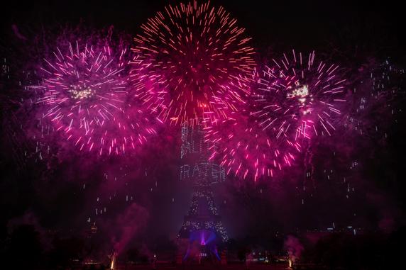 Fireworks and drones light up the Eiffel Tower in Paris on July 14, 2025.