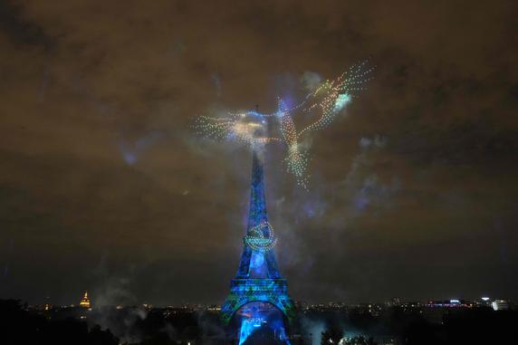 Fireworks and drones light up the Eiffel Tower in Paris on July 14, 2025.