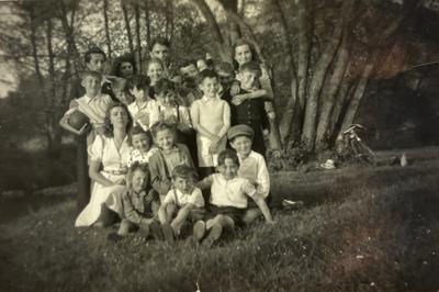 Renée Lamartine on vacation in the summer of 1945, near Cusset (Allier), second row, second from the left with the white bow in her hair.