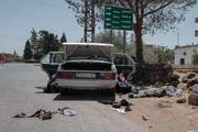 The bodies of four men lie on the side of a road in Al-Mazraa, in Sweida Governorate, Syria, July 16, 2025.