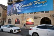 A poster depicting Donald Trump and the US ambassador to Israel, Mike Huckabee in Jerusalem, May 7, 2025.