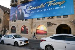 A poster depicting Donald Trump and the US ambassador to Israel, Mike Huckabee in Jerusalem, May 7, 2025.