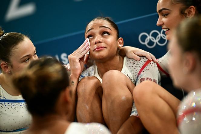 Mรฉlanie de Jesus dos Santos stands among her teammates on the French gymnastics team at Place de Bercy during the Paris Games, July 28, 2024.