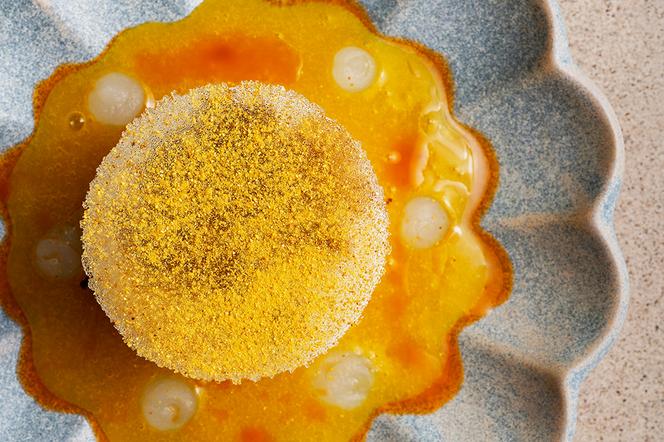 A passion fruit-saké île flottante.