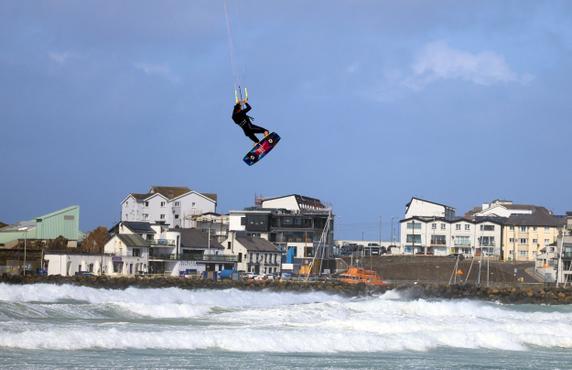 A man kite surfs during Storm Floris on the north coast of Northern Ireland, Portrush, on August 4, 2025. 