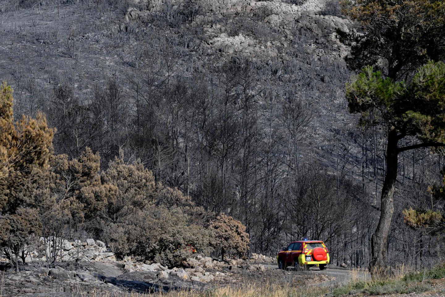 Firefighters battle to prevent reignition of France’s largest wildfire as residents return home