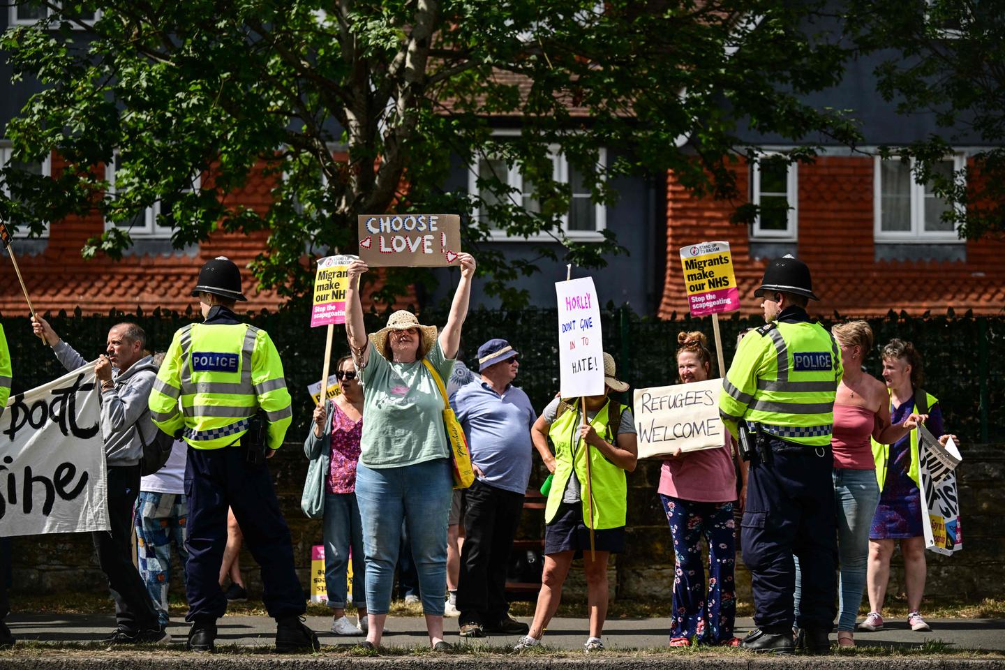 British government vows to speed up asylum claims as hotel protests spread