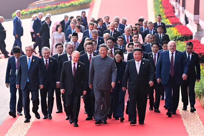 Chinese president Xi Jinping (center), Russian president Vladimir Putin (to his right), and North Korean leader Kim Jong Un (to his left) in Beijing on September 3, 2025. Photo published by Xinhua News Agency.