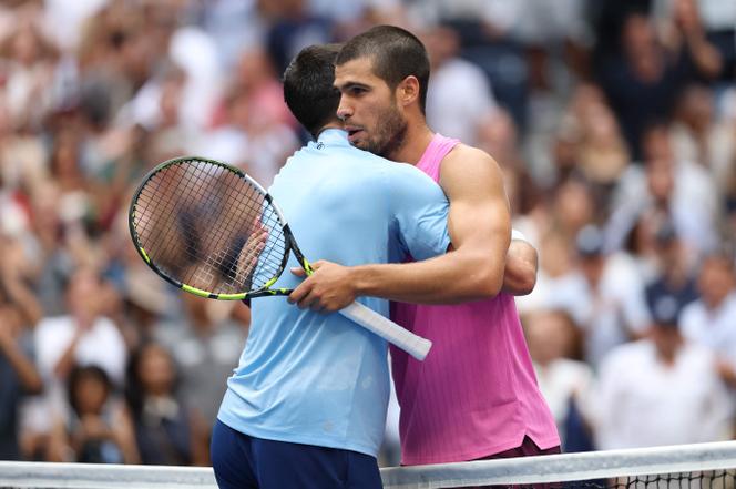 Carlos Alcaraz of Spain at the net after defeating Novak Djokovic of Serbia during their Men's Semifinal match on Day Thirteen of the 2025 US Open at USTA Billie Jean King National Tennis Center in the Flushing neighborhood of Queens in New York City on September 5, 2025.
