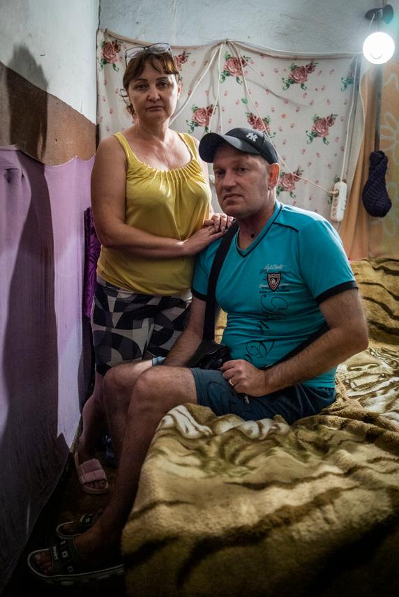 Oksana, 52, lives in this workers' dormitory with her husband, Kherson, August 25, 2025.