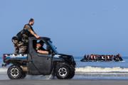 French gendarmes monitor migrants attempting to cross the Channel off the coast of Neufchâtel-Hardelot, northern France, on June 30, 2025.