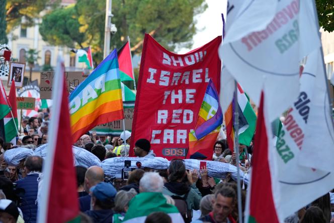 People protest against the participation of the Israeli national team in the 2026 Soccer World Cup qualification match against Italy, in Udine, Italy, October 14, 2025. 