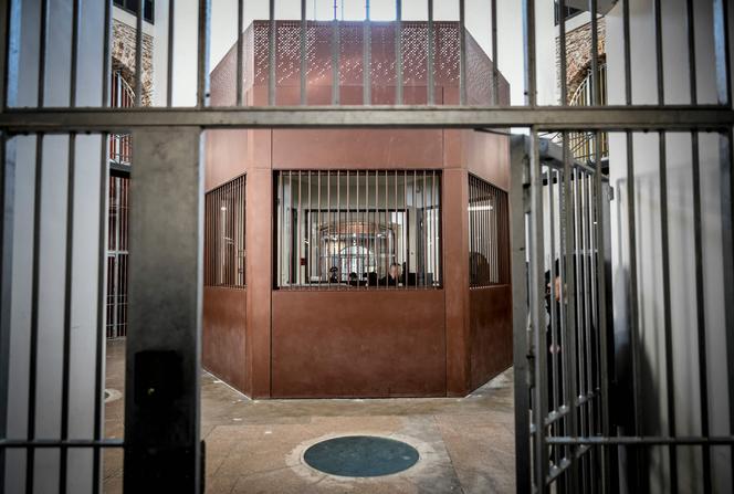 A prison guard is seen at work in one of the 