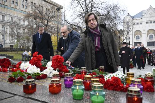 Foreign diplomats, including the French ambassador to Russia, Nicolas de Rivière (right), and the British ambassador to Russia, Nigel Casey (left), lay flowers at the foot of the Solovki Stone, a memorial installed in 1990 in the Russian capital in front of the KGB (now FSB) headquarters in Moscow, on October 29, 2025.