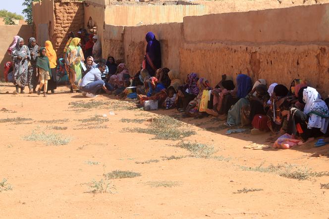 Refugees from the towns of Bara and Um Dam Haj Ahmed, in North Kordofan state, seek refuge in Omdurman, in the Khartoum metropolitan area, on November 10, 2025. 